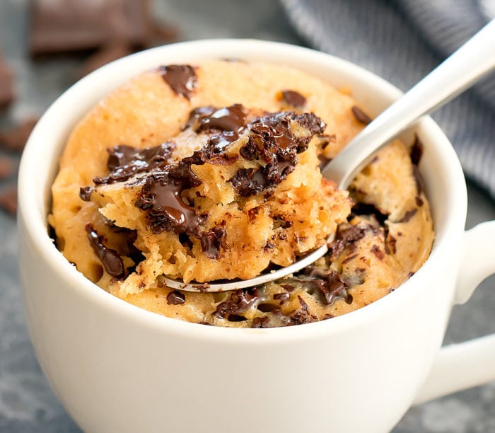 close-up photo of a Peanut Butter Chocolate Chip Mug Cake with a spoon