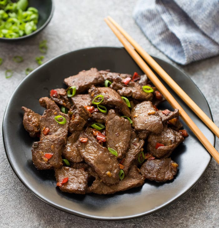 photo of a plate of Spicy Hunan Beef with chopsticks