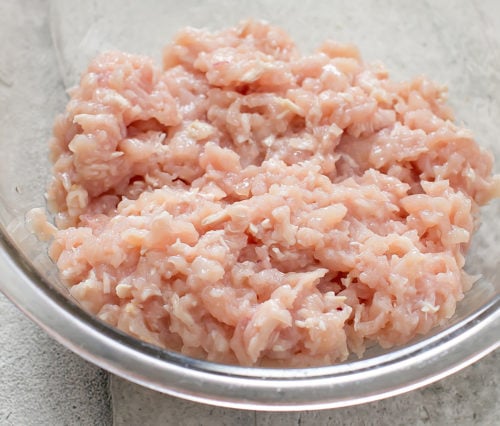 photo of a bowl of raw ground chicken