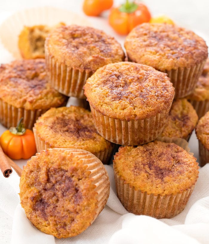 photo of pumpkin snickerdoodle muffins stacked on each other