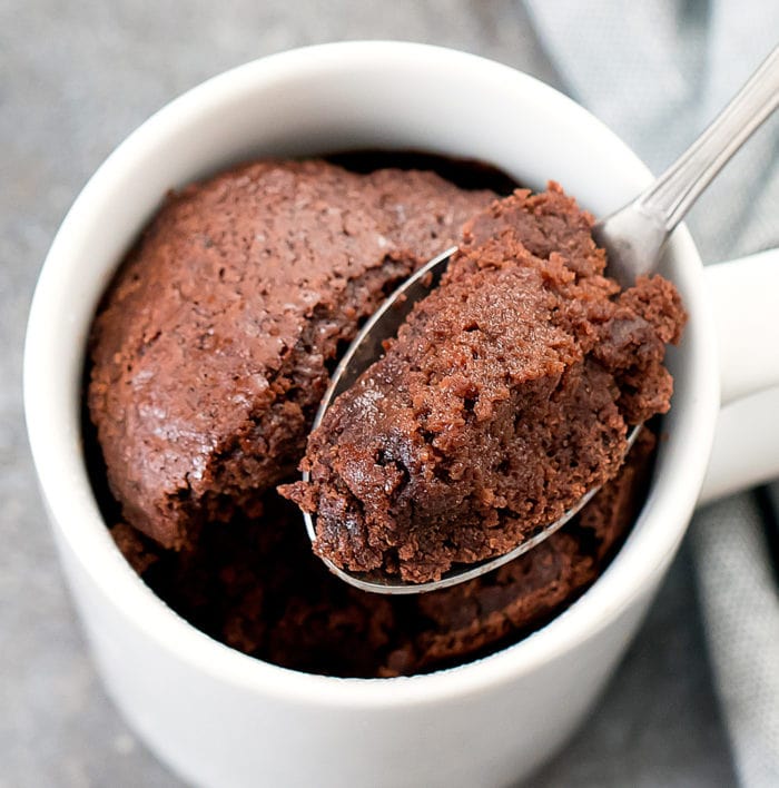 photo of a spoon scooping cake out of a mug