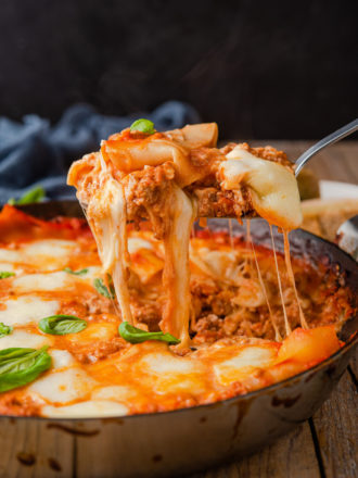 photo of skillet lasagna being scooped out of the pan