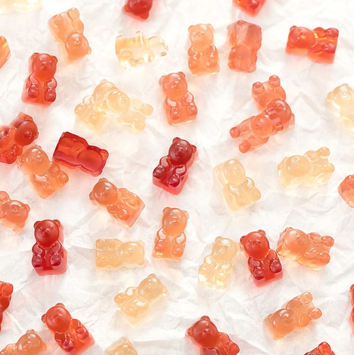 overhead photo of gummy bears on parchment