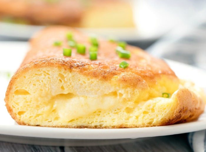 close-up photo of a an omelette with cheese in the center