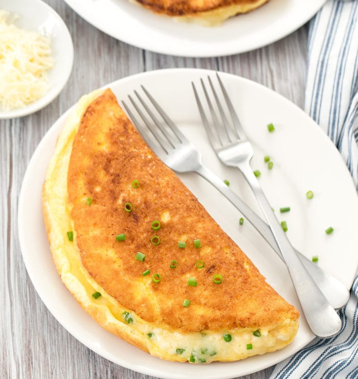 overhead photo of a souffle omelette on a plate with two forks