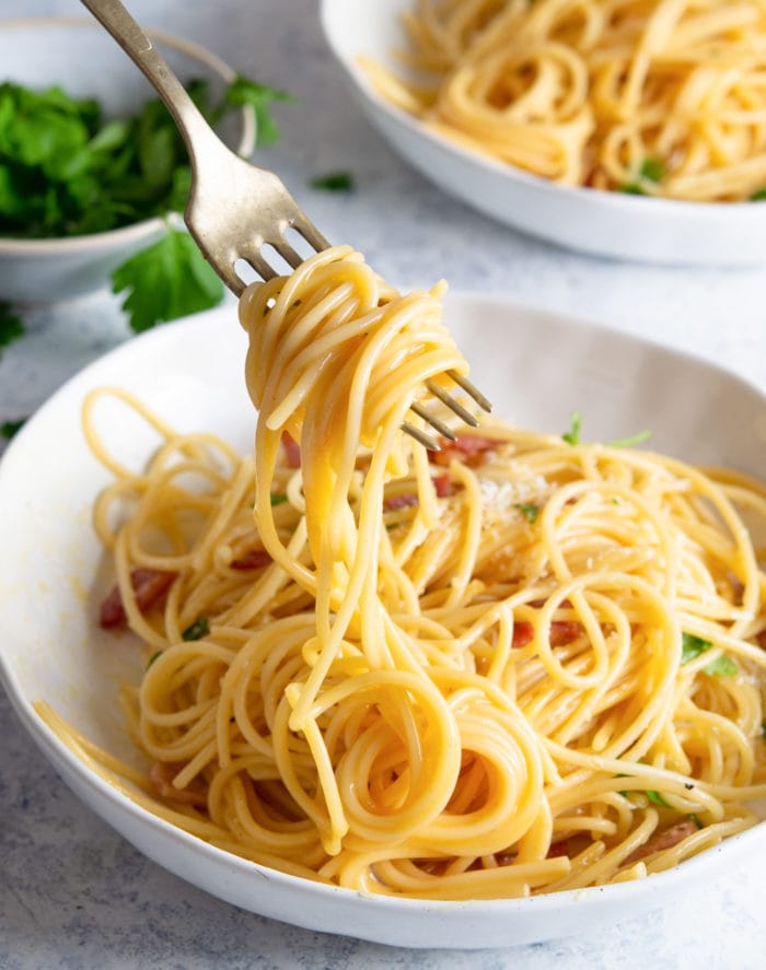 photo of a fork with pasta carbonara