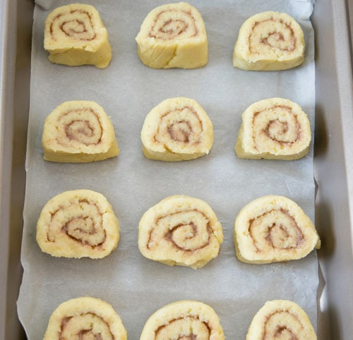 overhead photo of the sliced dough rounds in a baking pan