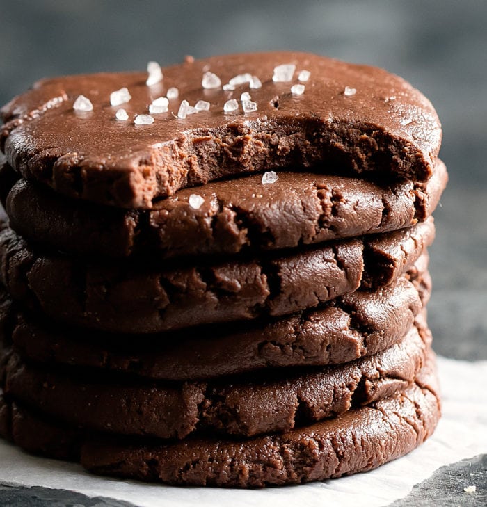 stack of cookies with the top with a bite removed.