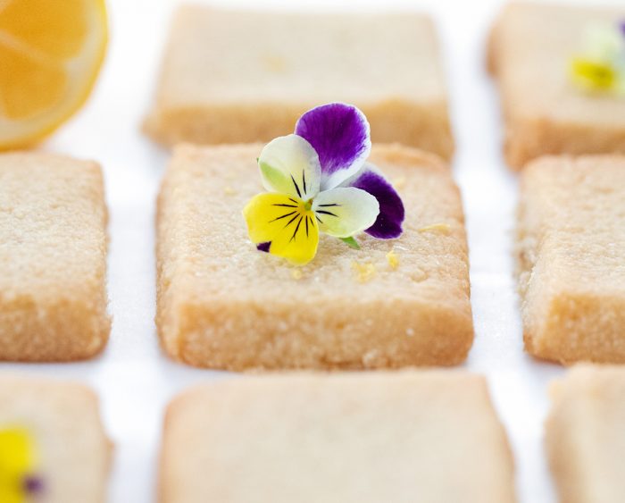 a shortbread cookie with a flower on top.