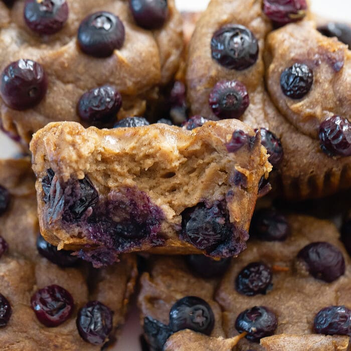 close-up photo of half a blueberry muffin.