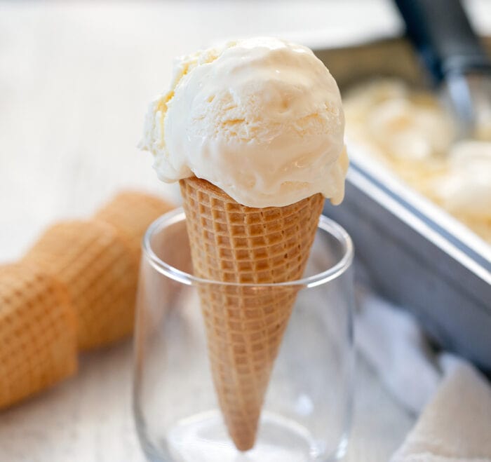 an ice cream cone with a scoop on top.