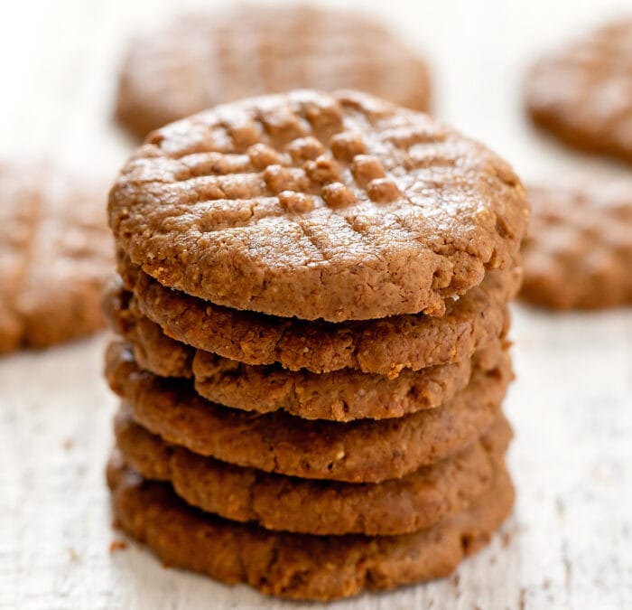 close up photo of a stack of almond butter cookies.