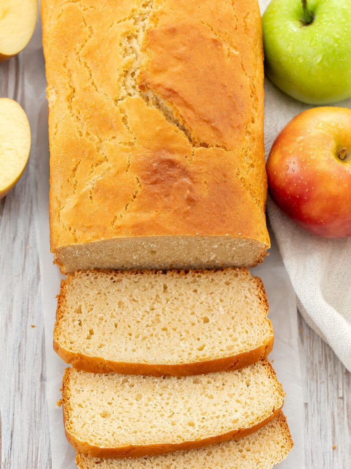 overhead photo of a sliced loaf of apple bread.