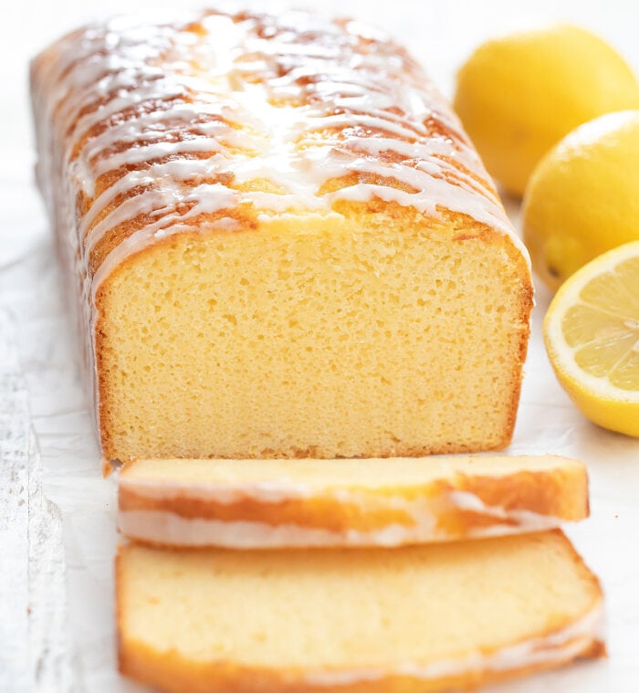 a loaf of lemon bread with two slices cut off.