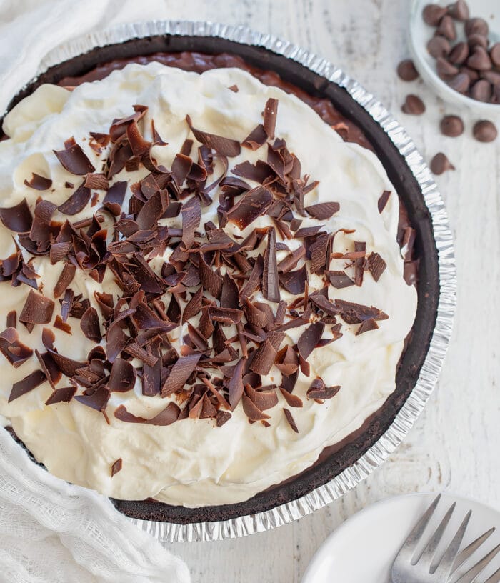 overhead shot of the silk pie topped with whipped cream and shaved chocolate.