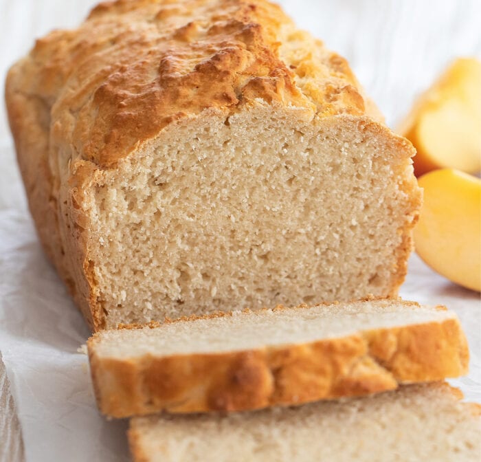 a loaf of apple bread with slices cut off.
