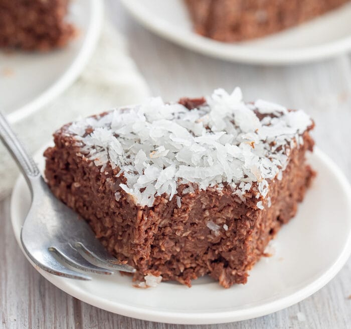one slice of cake topped with coconut.