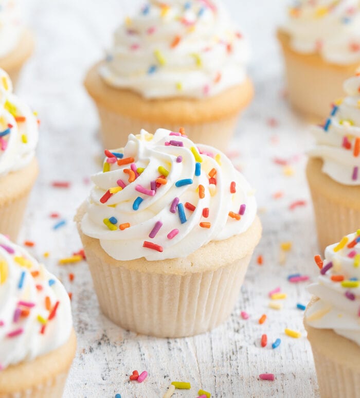 frosted cupcakes with sprinkles.