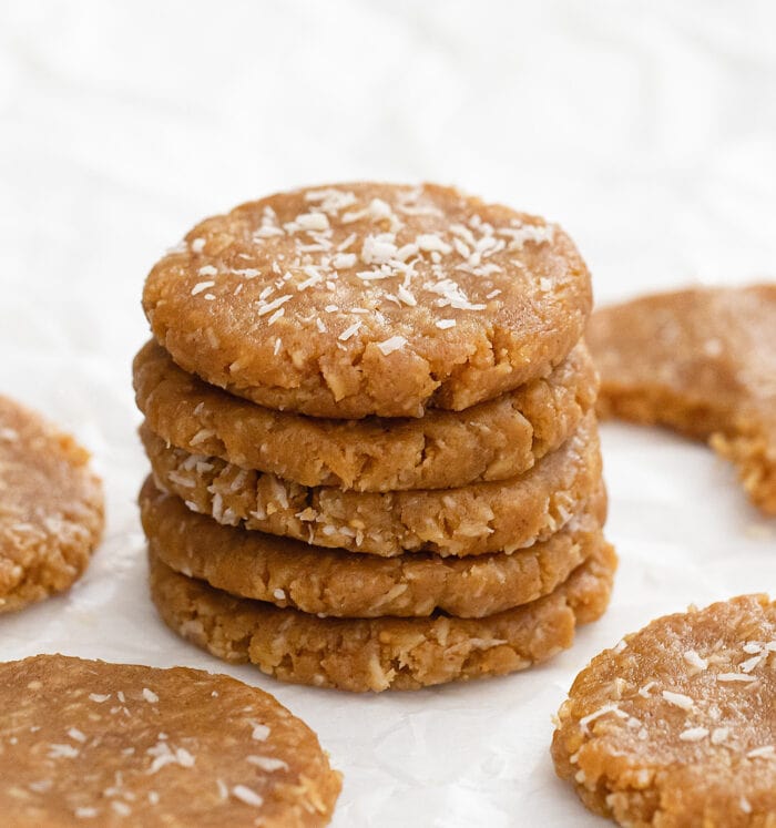 a stack of five no bake coconut cookies.
