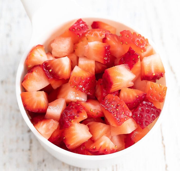 a bowl of diced strawberries.