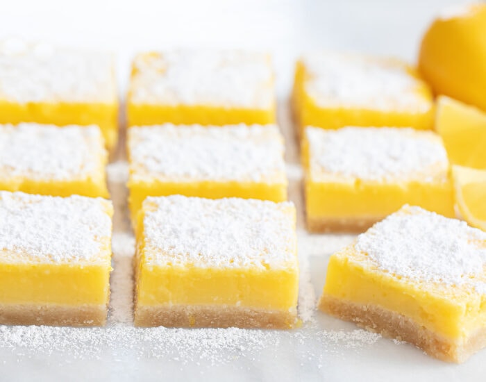 sliced lemon bars dusted with powdered sugar.