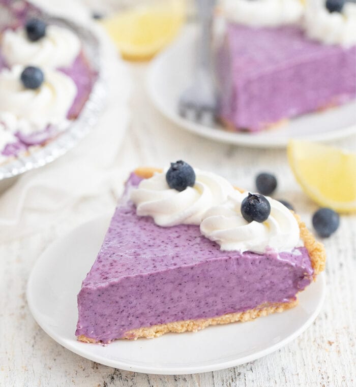 a slice of blueberry lemon pie on a plate.