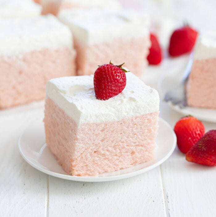 a slice of strawberry cloud cake on a plate.