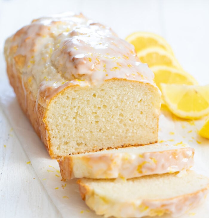 a loaf of lemon bread with two slices sliced off.