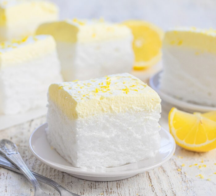 a slice of lemon cloud cake on a plate.