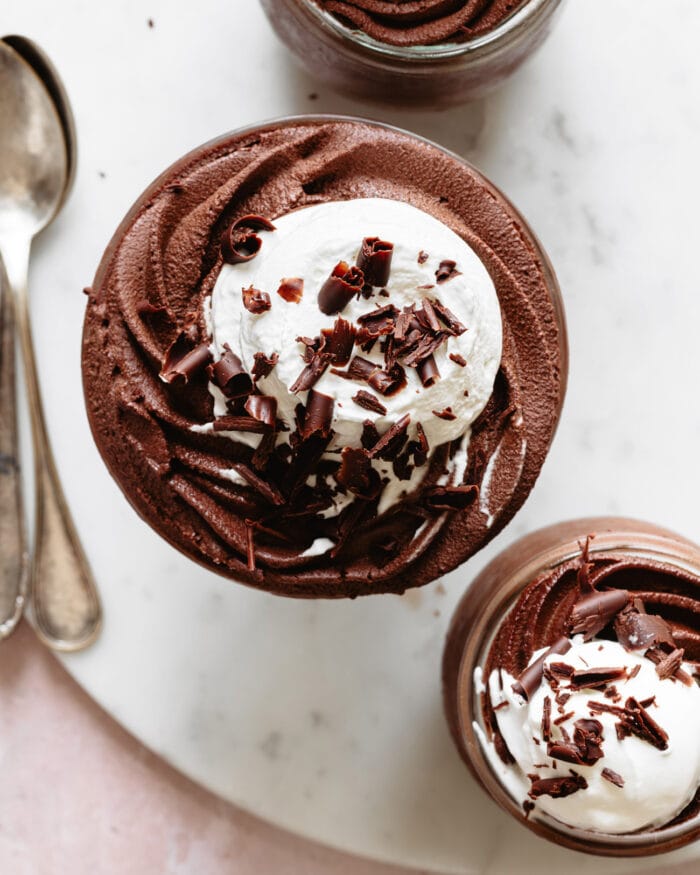 chocolate mousse topped with whipped cream and grated chocolate.