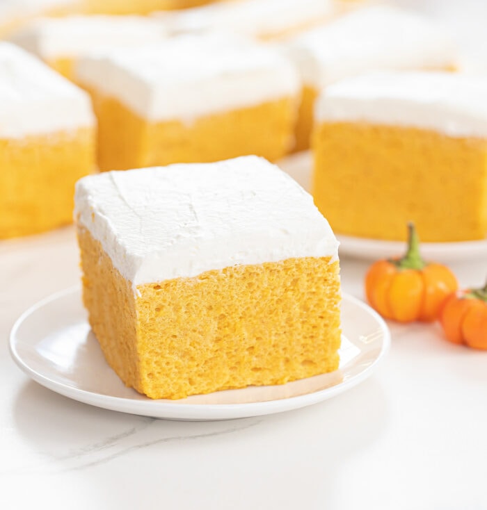 a slice of pumpkin cloud cake on a small white plate.