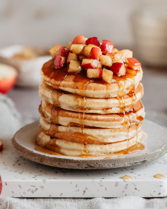a stack of apple pancakes on a plate.