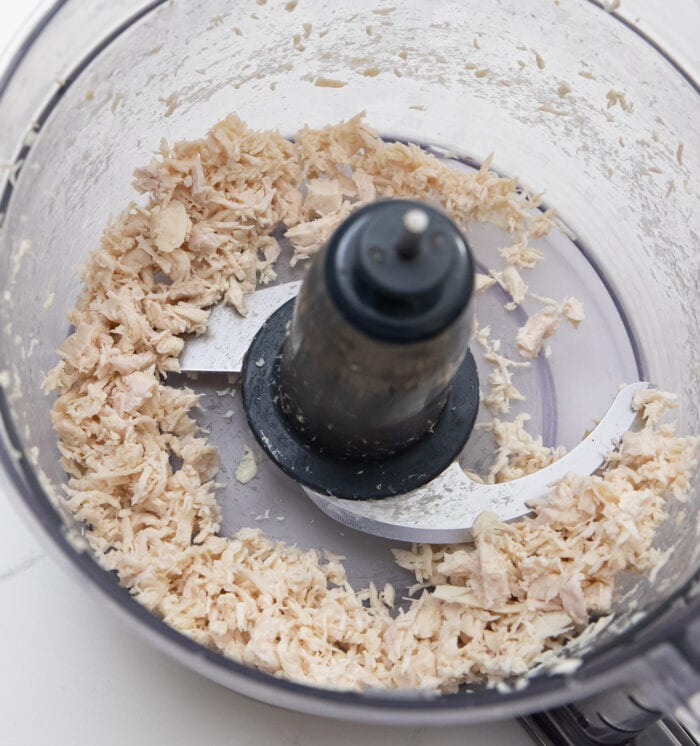 chopped cooked chicken in a food processor.