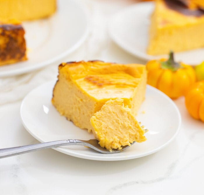 a slice of pumpkin cheesecake on a plate.