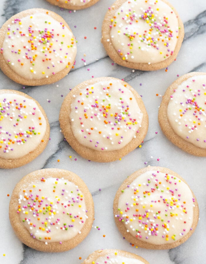 no bake cookies topped with frosting and sprinkles.
