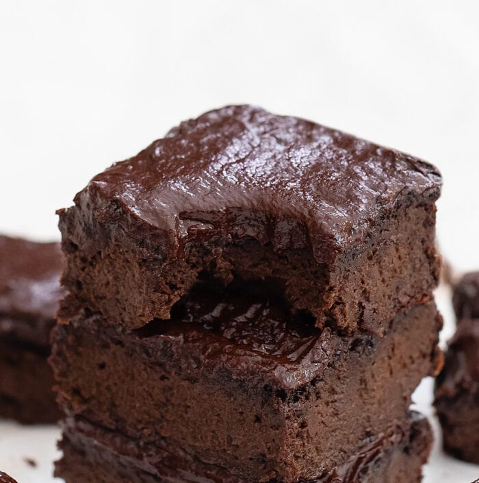 a frosted brownie with a bite out of it.