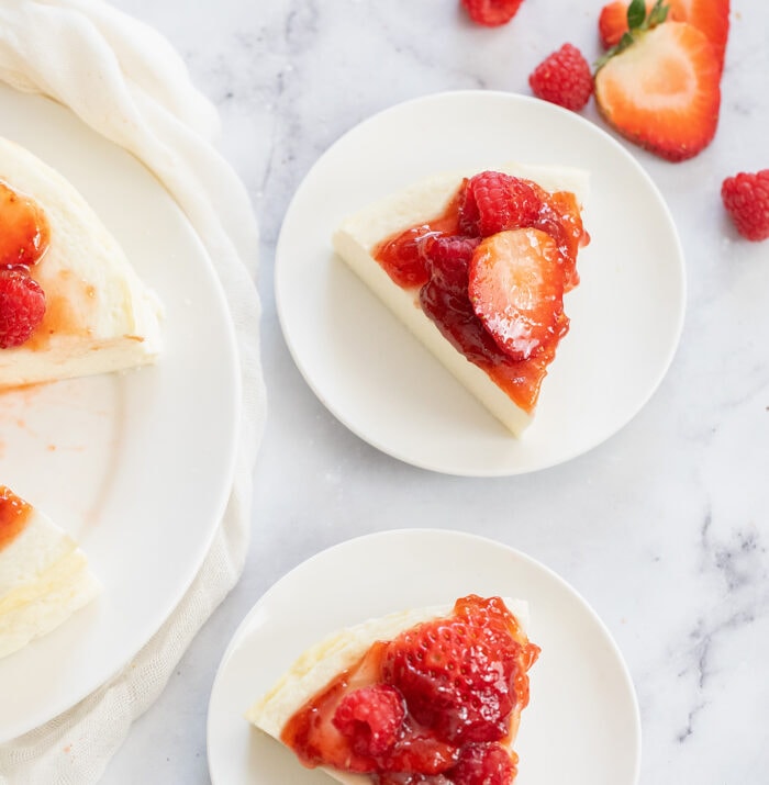 slices with strawberries on small plates.