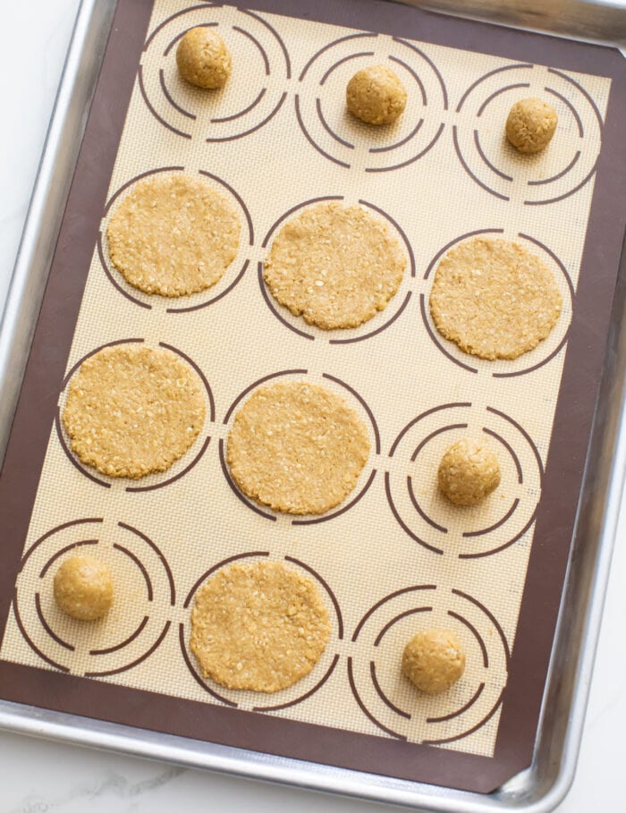 cookie dough pressed on a cookie sheet.