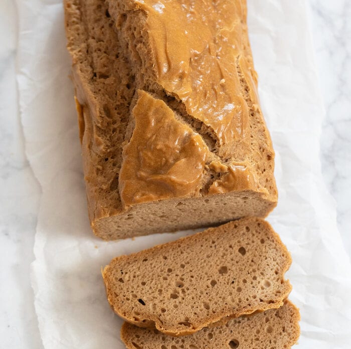 A loaf of keto bread with 2 slices cut from it