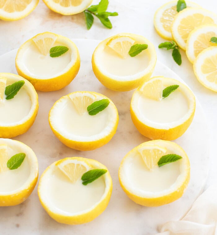 Lemon posset dessert served in hollowed out lemon shells