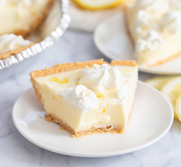 Slice of lemon pie with a bite taken from it