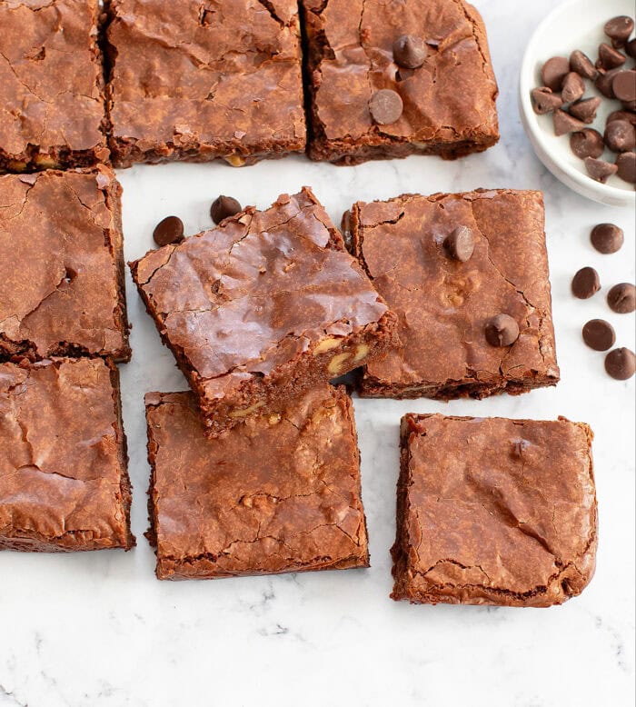 A close up of magic bar brownies with chocolate chips