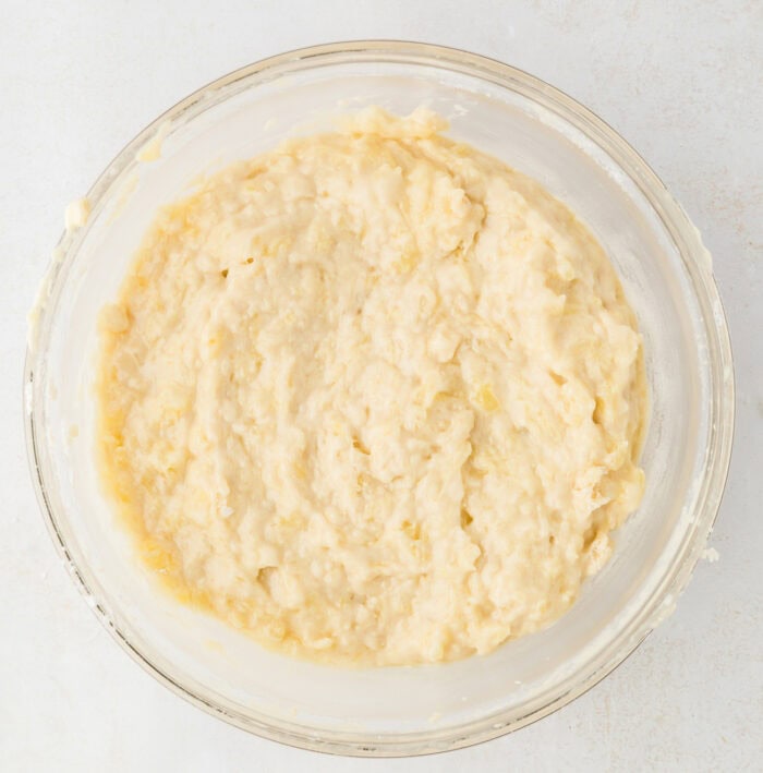 Pineapple cake batter in a glass bowl