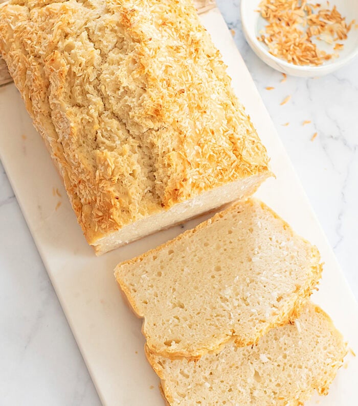 Coconut bread with two slices cut from it