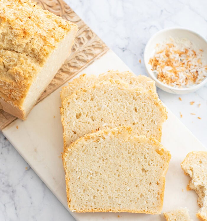 Coconut bread slices on a serving board