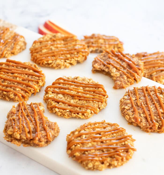 Caramel apple oatmeal cookies with a caramel drizzle