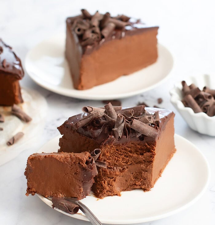 Taking a bite from a piece of no bake chocolate cake