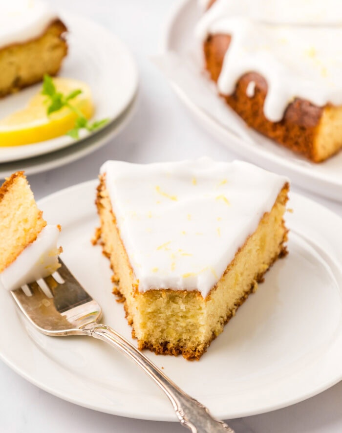 A bite taken from a slice of keto lemon cake