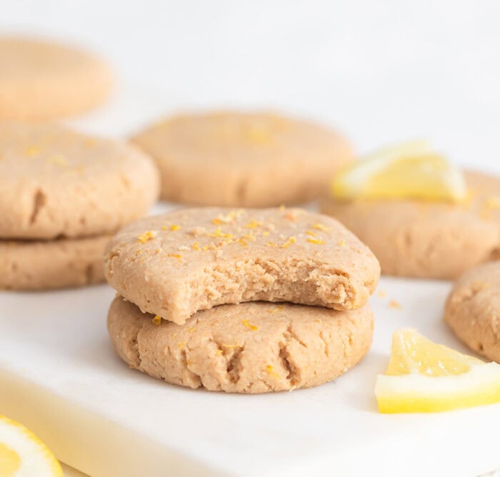 A bite taken from a lemon oat cookie