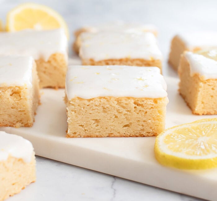 Lemon brownies with icing and lemon zest